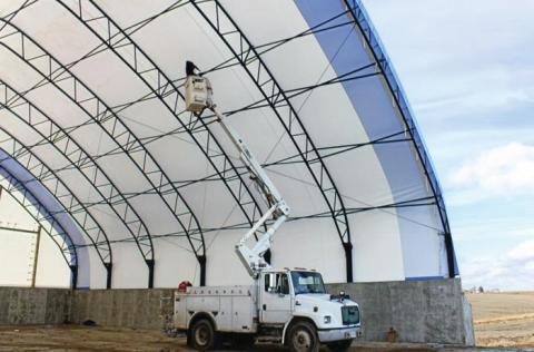working on fabric covered building